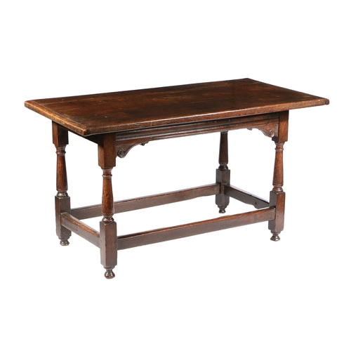 175 - A CHARLES I OAK LONG TABLE, CIRCA 1640. Having a boarded cleated top, the front rail channel moulded... 