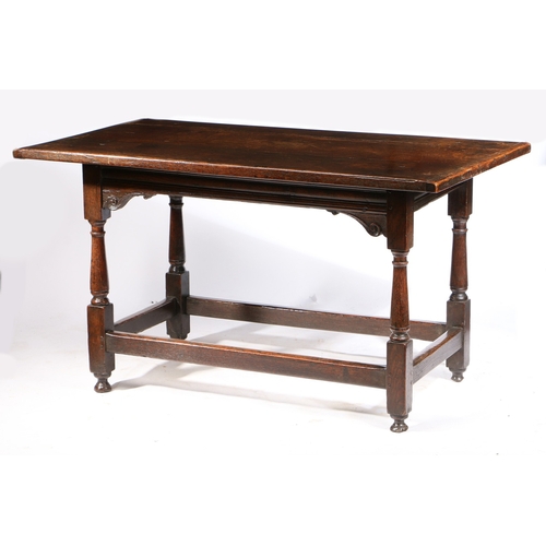 175 - A CHARLES I OAK LONG TABLE, CIRCA 1640. Having a boarded cleated top, the front rail channel moulded... 