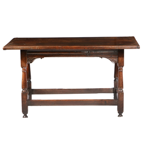 175 - A CHARLES I OAK LONG TABLE, CIRCA 1640. Having a boarded cleated top, the front rail channel moulded... 