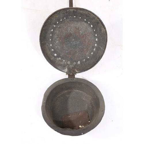 182 - A CHARLES I BRASS AND IRON WARMING PAN, CIRCA 1640. The circular domed brass cover decorated with th... 