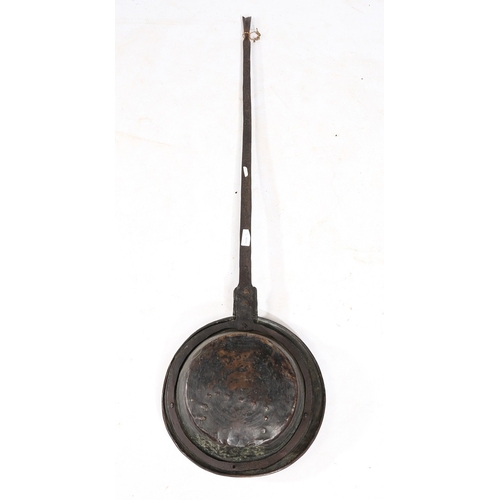 182 - A CHARLES I BRASS AND IRON WARMING PAN, CIRCA 1640. The circular domed brass cover decorated with th... 