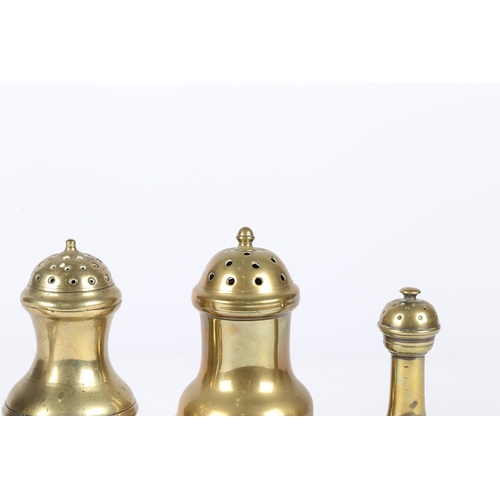 191 - A GROUP OF FOUR GEORGE III CAST BRASS CASTERS OR PEPPERETTES, CIRCA 1780-1800. Each of baluster form... 