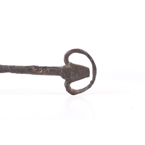 201 - A LARGE AND IMPRESSIVE 14TH CENTURY IRON KEY, ENGLISH, CIRCA 1300. Having a long pointed solid shank... 