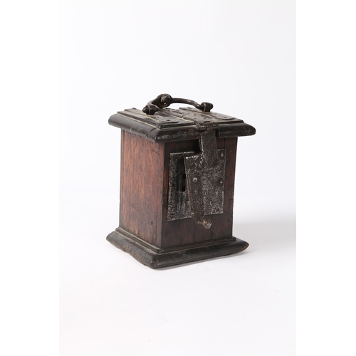 214 - A 17TH CENTURY OAK AND IRON BOUND ALMS BOX, ENGLISH. The hinged lid with moulded edge, a central coi... 