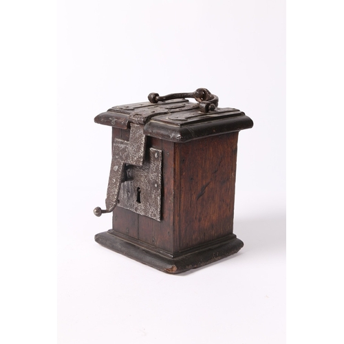 214 - A 17TH CENTURY OAK AND IRON BOUND ALMS BOX, ENGLISH. The hinged lid with moulded edge, a central coi... 