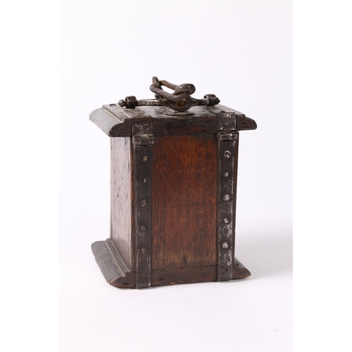 214 - A 17TH CENTURY OAK AND IRON BOUND ALMS BOX, ENGLISH. The hinged lid with moulded edge, a central coi... 