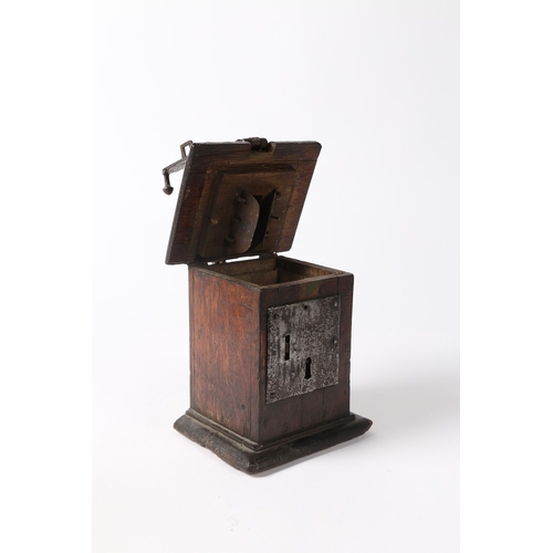 214 - A 17TH CENTURY OAK AND IRON BOUND ALMS BOX, ENGLISH. The hinged lid with moulded edge, a central coi... 