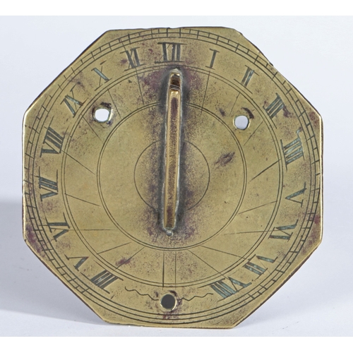 215 - A SMALL BRASS HORIZONTAL SUNDIAL. The octagonal plate with engraved Roman numeral hour scale and dec... 