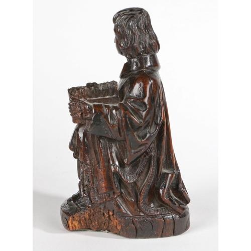 239 - A GOOD 16TH CENTURY CARVED OAK FIGURE OF A MALE MUSICIAN. Modelled seated, wearing flowing robes, a ... 