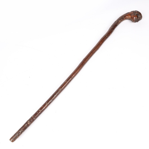 31 - A 19TH CENTURY WALKING STICK, ENGLISH. The handle carved as the face of an old gentleman, wearing a ... 