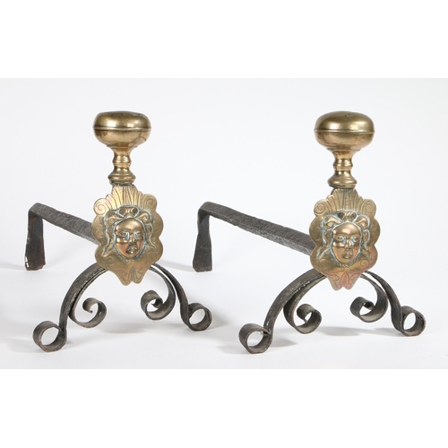 35 - A PAIR OF BRASS AND IRON ANDIRONS/FIRE-DOGS, FLEMISH, CIRCA 1700. Each having a large brass ball kno... 