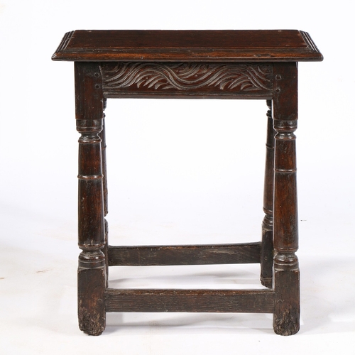 37 - A CHARLES II OAK JOINT STOOL, DEVON, CIRCA 1660. Having a triple-reeded top, meandering scroll-carve... 