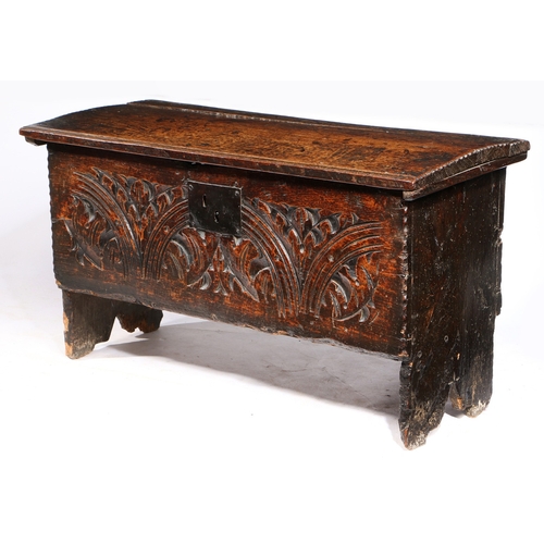 370 - A CHARLES I CARVED OAK AND ELM BOARDED CHEST, WEST COUNTRY, CIRCA 1630, WITH RARE CHARLES II PRINTED... 