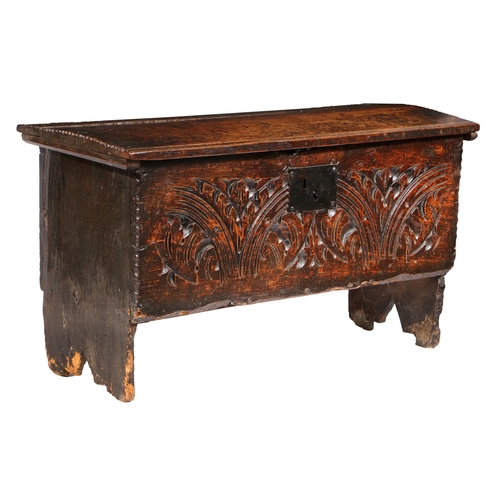 370 - A CHARLES I CARVED OAK AND ELM BOARDED CHEST, WEST COUNTRY, CIRCA 1630, WITH RARE CHARLES II PRINTED... 