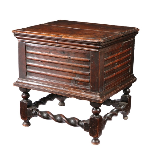 371 - A CHARLES II OAK CLOSED STOOL, CIRCA 1680. Having a boarded ovolo-moulded box hinged lid, the front ... 