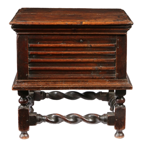 371 - A CHARLES II OAK CLOSED STOOL, CIRCA 1680. Having a boarded ovolo-moulded box hinged lid, the front ... 