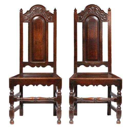 372 - A PAIR OF WILLIAM & MARY OAK HIGH-BACK CHAIRS, LANCASHIRE, CIRCA 1690. Each with a part open and arc... 