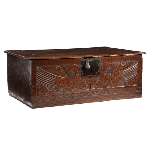 386 - A CHARLES II BOARDED OAK BOX, CIRCA 1670. The hinged lid principally of one board, with moulded edge... 