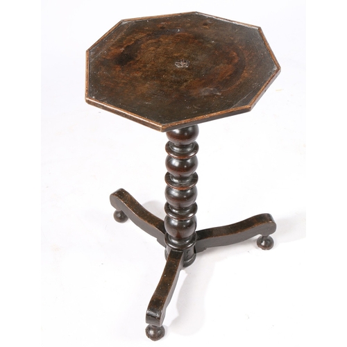 387 - A LATE 17TH CENTURY OAK CANDLESTAND, ENGLISH, CIRCA 1680-1700. Having an octagonal top with applied ... 