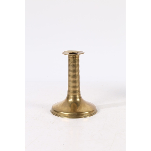 388 - A RARE CHARLES II BRASS TRUMPET-BASE SOCKET CANDLESTICK, CIRCA 1675. With corded stem, wide flat cir... 