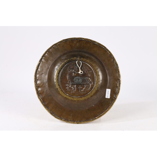 389 - A RARE SIZE 16TH CENTURY BRASS ALMS DISH, NUREMBERG, CIRCA 1500-50. Decorated with an Agnus Dei to c... 