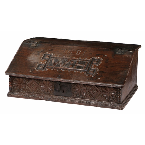 40 - A CHARLES II BOARDED OAK DESK BOX, NORTH COUNTRY, DATED 1681. With fixed top, the sloping fall carve... 