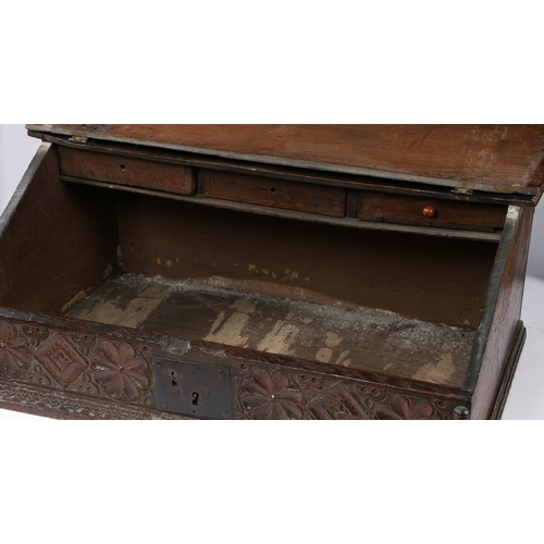 40 - A CHARLES II BOARDED OAK DESK BOX, NORTH COUNTRY, DATED 1681. With fixed top, the sloping fall carve... 