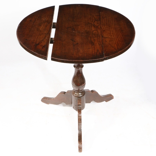 41 - AN EARLY 18TH CENTURY OAK BIRD-CAGE TRIPOD TABLE, ENGLISH, CIRCA 1700-20. The circular revolving and... 