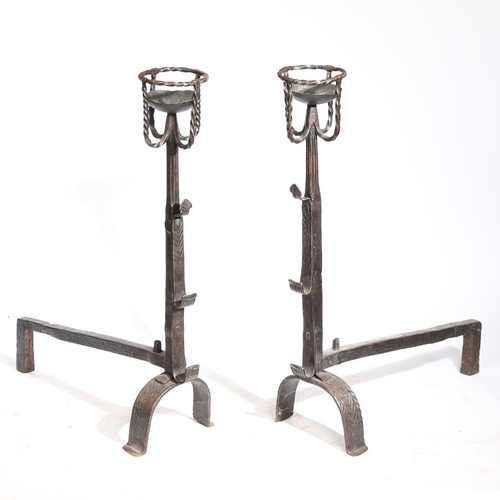 42 - A GOOD PAIR OF 17TH CENTURY STYLE IRON CRESSET FIREDOGS. Each with a twist-work cresset, triple spit... 