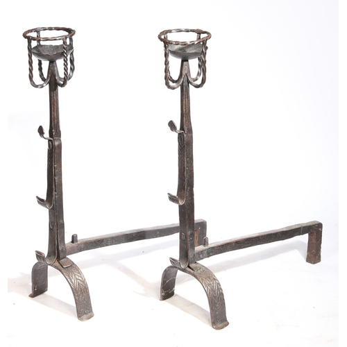 42 - A GOOD PAIR OF 17TH CENTURY STYLE IRON CRESSET FIREDOGS. Each with a twist-work cresset, triple spit... 