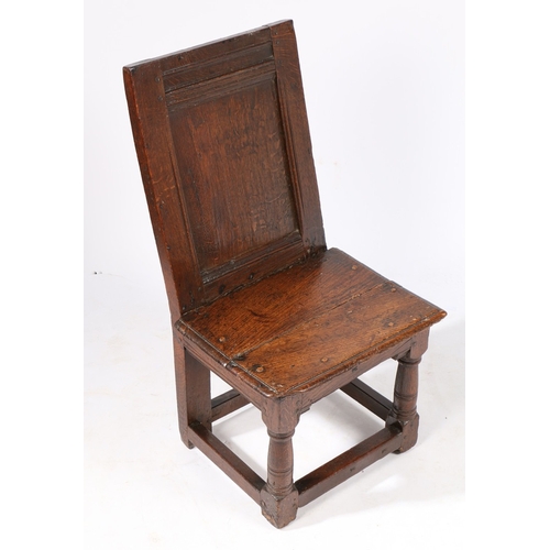 422 - A RARE ELIZABETH I/JAMES I OAK LOW BACKSTOOL, OR CHILD'S CHAIR, CIRCA 1600-20. Having a plain back p... 