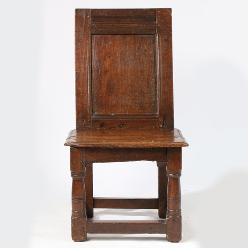 422 - A RARE ELIZABETH I/JAMES I OAK LOW BACKSTOOL, OR CHILD'S CHAIR, CIRCA 1600-20. Having a plain back p... 