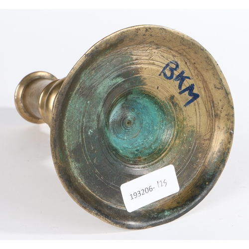 44 - A LATE 17TH CENTURY BRASS SOCKET CANDLESTICK, CIRCA 1690. Having a tapering cylindrical flanged sock... 