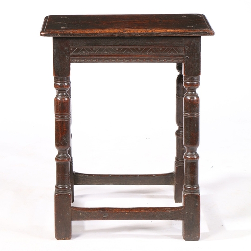 60 - A CHARLES I OAK JOINT STOOL, CIRCA 1630. The top with simple moulded edge, the run-moulded rails wit... 