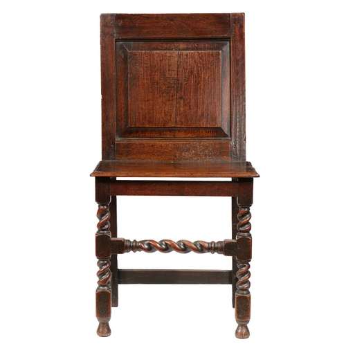 61 - AN UNCOMMON CHARLES II OAK BACKSTOOL, CIRCA 1680. Having a fully enclosed back, with fielded panel, ... 