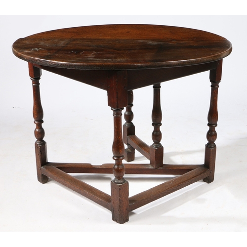 62 - AN RARE WILLIAM & MARY OAK SINGLE DROP-LEAF TABLE, CIRCA 1690. Having a demi-lune top, and triangula... 