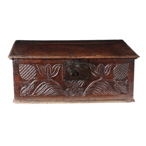 63 - A CHARLES II OAK BOARDED BOX, NORTH COUNTRY, CIRCA 1670. The lid principally of one wide board, the ... 