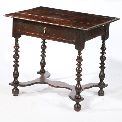 75 - A WILLIAM AND MARY OAK SIDE TABLE , CIRCA 1690. Having a triple boarded top with ovolo-moulded edge,... 