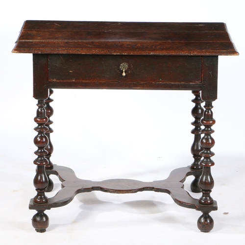 75 - A WILLIAM AND MARY OAK SIDE TABLE , CIRCA 1690. Having a triple boarded top with ovolo-moulded edge,... 