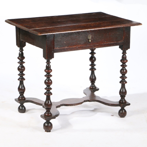 75 - A WILLIAM AND MARY OAK SIDE TABLE , CIRCA 1690. Having a triple boarded top with ovolo-moulded edge,... 