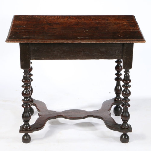 75 - A WILLIAM AND MARY OAK SIDE TABLE , CIRCA 1690. Having a triple boarded top with ovolo-moulded edge,... 