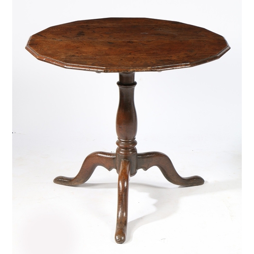 76 - A RARE GEORGE II OAK MULTI-SIDED TRIPOD SUPPER TABLE, CIRCA 1740. Having a round, sixteen-sided and ... 