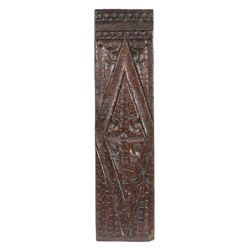 80 - A HENRY VIII CARVED OAK AND PUNCH-DECORATED PANEL, CIRCA 1520-40. Carved with an elongated and segme... 