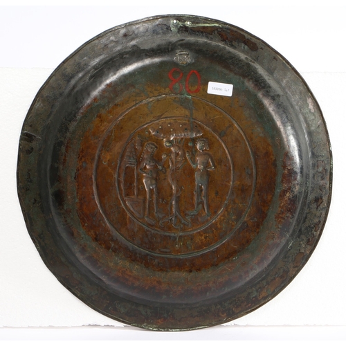 85 - A RARE 16TH CENTURY BRASS ALMS DISH, NUREMBERG, CIRCA 1500-50. Decorated with Adam and Eve to the ce... 