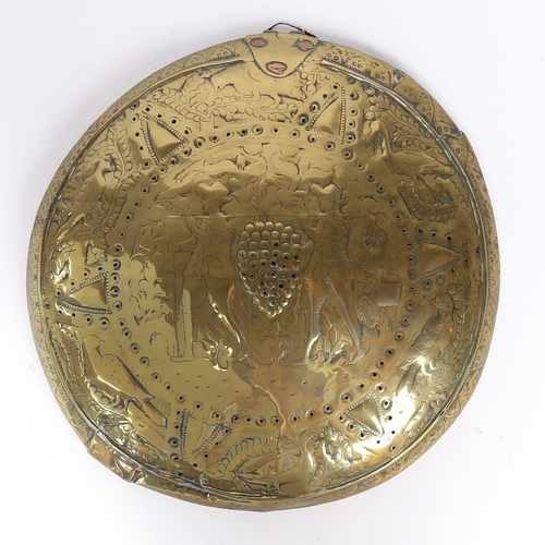 88 - A 17TH CENTURY BRASS WARMING PAN LID, DUTCH. The domed lid decorated with the Spies of Canaan, Joshu... 