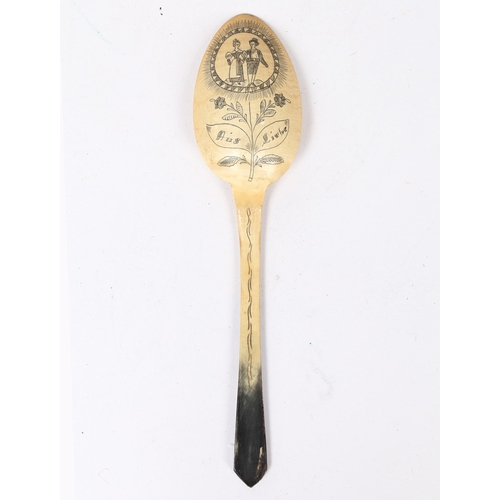 94 - A 19TH CENTURY ENGRAVED HORN LOVE TOKEN SPOON, GERMAN. Having a tapering stem with pointed terminal,... 