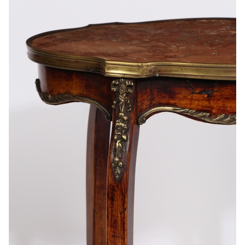 11 - A 19TH CENTURY FRENCH MARBLE TOPPED TWO TIER TABLE. having a shaped rouge marble top with a brass ed... 