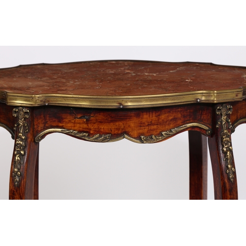 11 - A 19TH CENTURY FRENCH MARBLE TOPPED TWO TIER TABLE. having a shaped rouge marble top with a brass ed... 