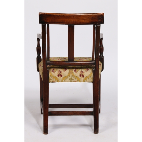 18 - A REGENCY MAHOGANY CHILDS ARMCHAIR. having a horizontal splat back raised on reeded arms on a uphols... 