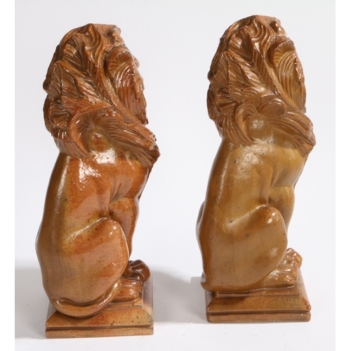 250 - ALFRED G HOPKINS (1884-1940), A PAIR OF SALT GLAZED STONEWARE LIONS. both stamped A G Hopkins - Lamb... 